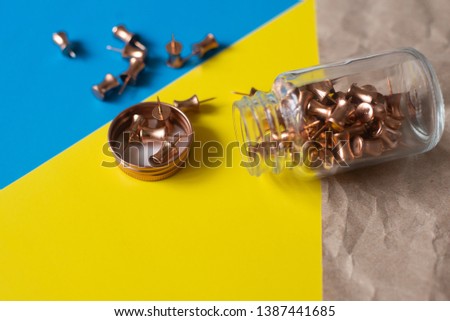 Push pins fall out of the can