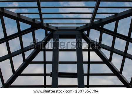 Metal Steel roof frame , steel roof structure framework with blue sky in background.