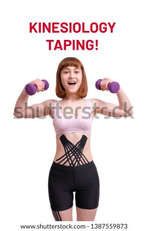 smiling young white girl with kinesiology tape on her body with dumbbells isolated on white background. vertical view