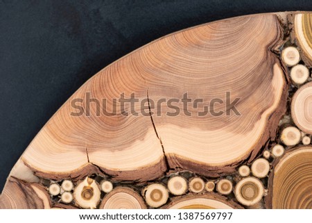 Board with sawed branches by juniper and acacia