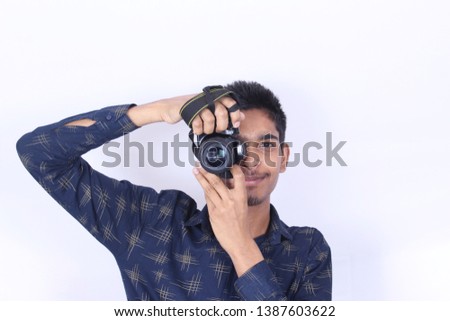 young man photo shooting with camera