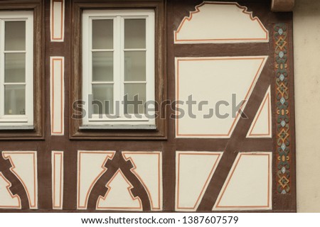 A couple of windows in an half timbered house facade (Bacharach, Germany, Europe)