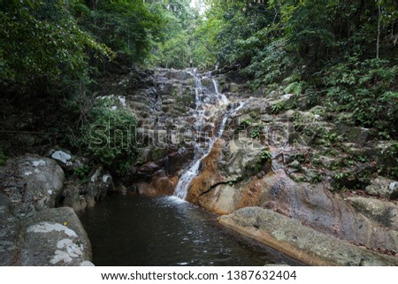 The tranquility of Kampong Mukut Waterfall, Tioman Island, Malaysia.