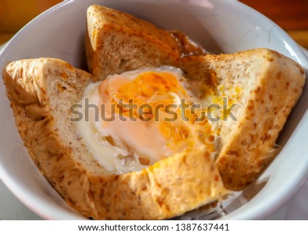 Egg baked with bread. Easy menu for breakfast in rush hour.