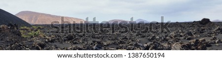 panorama picture of the volcanic landscape of Lanzarote around Timanfaya