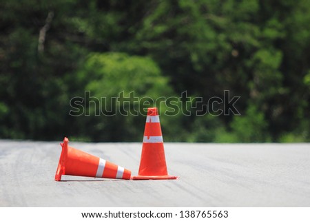 single orange entrance barrier cone isolated on white background. Security sign concept