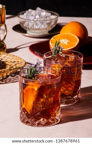 Negroni, an Iba cocktail, with 1/3 gin, 1/3 bitter, 1/3 vermut, in luxury pop style, rich and colorful. Royalty-Free Stock Photo #1387678961