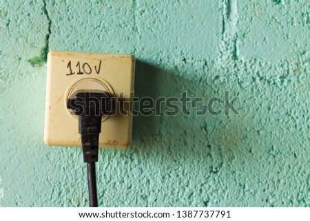 Power plug with 110v written on it