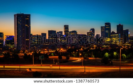 Night time cityscape nightscape of the capital cities , Denver Colorado skyline cityscape perfect time lapse of the downtown urban skyscrapers and office buildings at sunrise