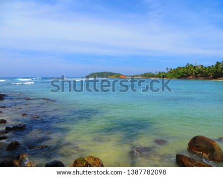 White waves in blue bay of the Indian ocean, Mirissa, Sri Lanka