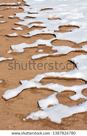 Snow and sand. Picture can be used as a background