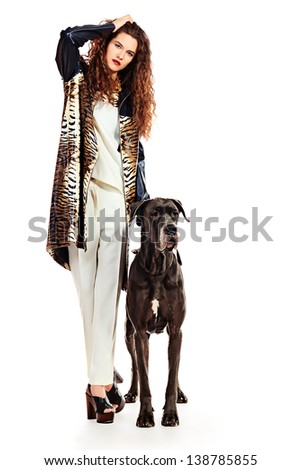 Beautiful young woman posing with her Great Dane dog. Isolated over white.