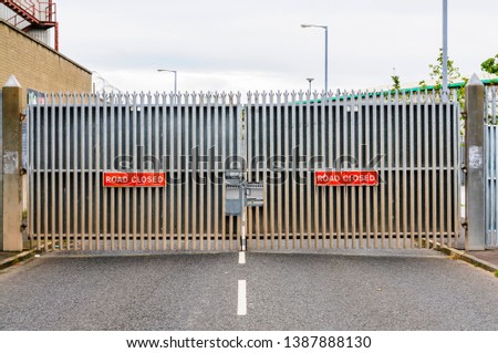 Closed gate across a road at one of the Belfast "Peace Walls"