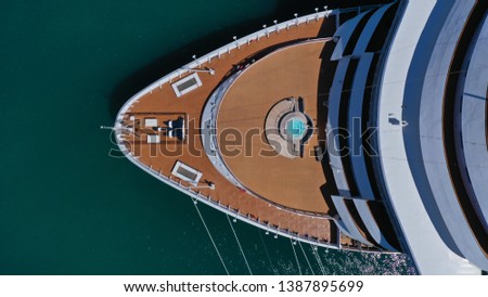 Aerial top view photo of huge cruise ship docked in mediterranean port destination