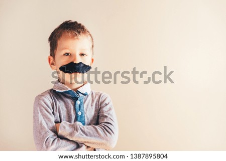 Child with mustache isolated on white.