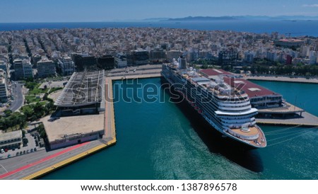 Aerial top view photo of huge cruise ship docked in port of Piraeus one of the largest in Europe, Attica, Greece