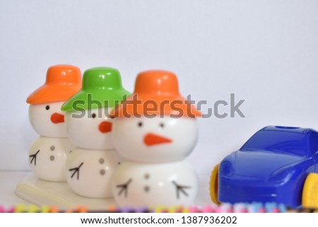 beautiful snowman with colorful  caps