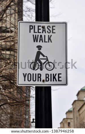 Please walk your bike sign