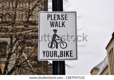 Please walk your bike signpost