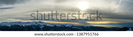 Panoramic view of the Caucasus mountains covered by snow in the ski resort of Krasnaya Polyana