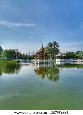 Floating traditional Thai resting house known as "Shala" in a lake with the reflection, located in summer palace, Ayutthaya province of Thailand. 