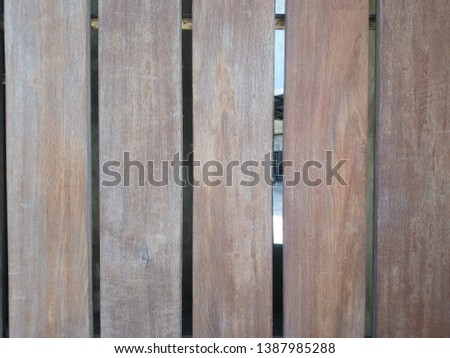Old wooden doors of rough vertical wooden walls