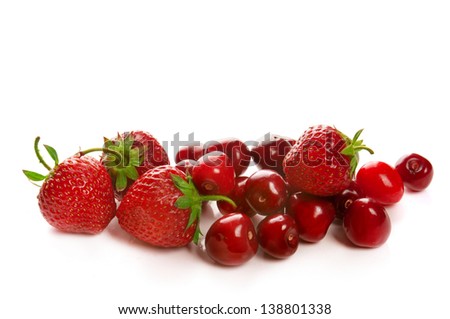 Fresh red ripe strawberries and cherries isolated on white