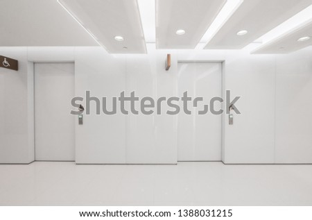 White automatic doors of public toilets in shopping malls