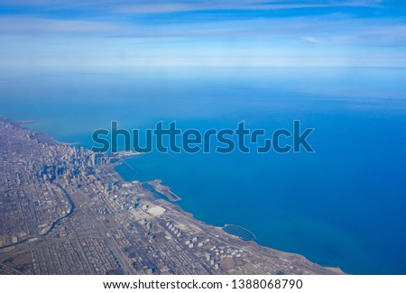 Aerial view of the Chicago skyline and Lake Michigan lakefront as seen from an airplane