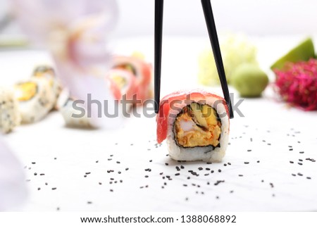 Sushi, uramaki with avocado shrimp and salmon