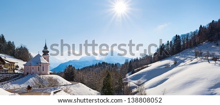 Watzmann at noon with church, Bavaria, Berchtesgaden, Germany Alps Royalty-Free Stock Photo #138808052