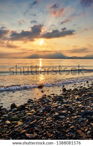 Beautiful sunrise on the shore of the tiny Isola Superiore Island on Lake Maggiore - one of the famous Lakes in northern Italy, Europe. Royalty-Free Stock Photo #1388081576