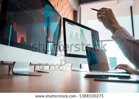 Business, do this deal on a stock exchange. People working in the office. Royalty-Free Stock Photo #1388100275