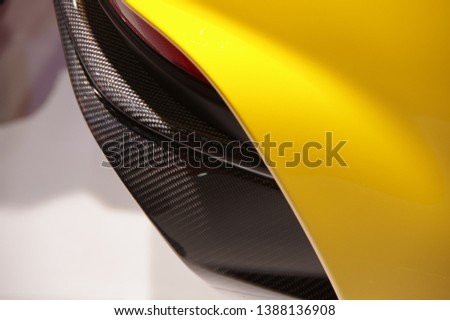 Modern yellow car carbon fiber detail