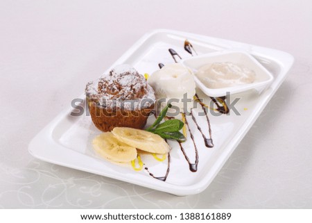 Tasty hot muffin with ice cream served mint