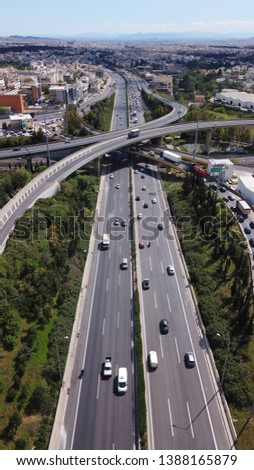 Aerial photo of multilevel elevated highway junction highway passing through modern city in multiple directions