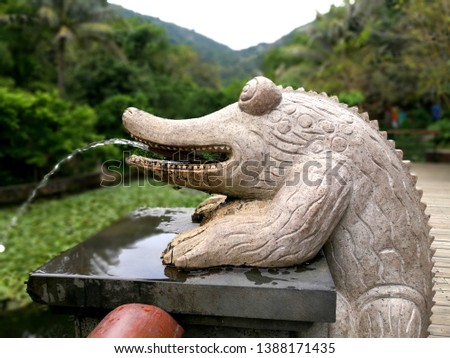Fountain china hainan park yalong wan asia stone statue crocodile