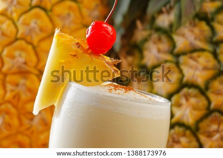 The Pina Colada is a sweet cocktail made with rum, coconut cream or coconut milk, and pineapple juice. It may be garnished with either a pineapple wedge, maraschino cherry, or both.