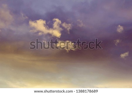 cloud in the form of the constellation of Cancer on the background of the evening pastel sky