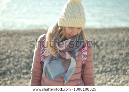 Portrait of beautiful Russian blond girl posing for photo at sea beach