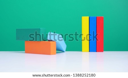 Colorful Toy Blocks on green background.