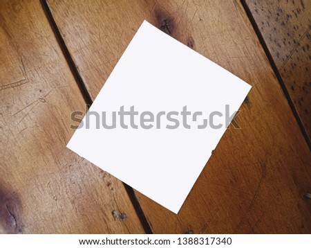 The paper with wood background. Paper notes concept.