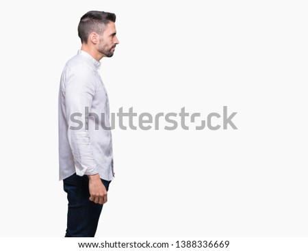 Young business man over isolated background looking to side, relax profile pose with natural face with confident smile.