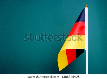 Flag of Germany isolated on green background.                         