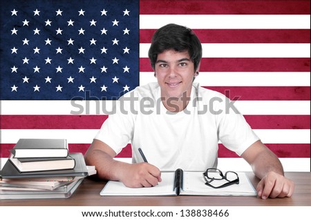young boy student on the background with americanl flag. english american language learning concept