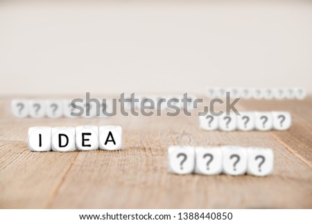 White cube blocks with question marks and Idea letters imprinted on cube surface, focused on Idea cubes; concept of Thinking, Idea and Success