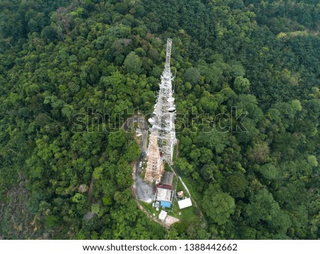 An aerial view of telecommunication tower of top of the hill