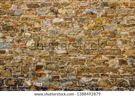 ancient stone wall in florence, italy