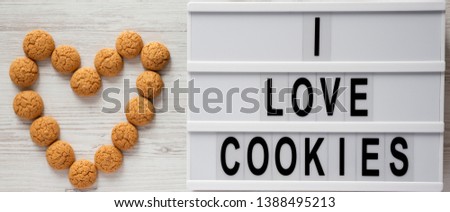Almond cookies and lightbox with 'I love cookies' words, view from above. Flat lay, top view, overhead.