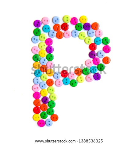 Letter P of the English alphabet from a group of colorful small buttons on a white background